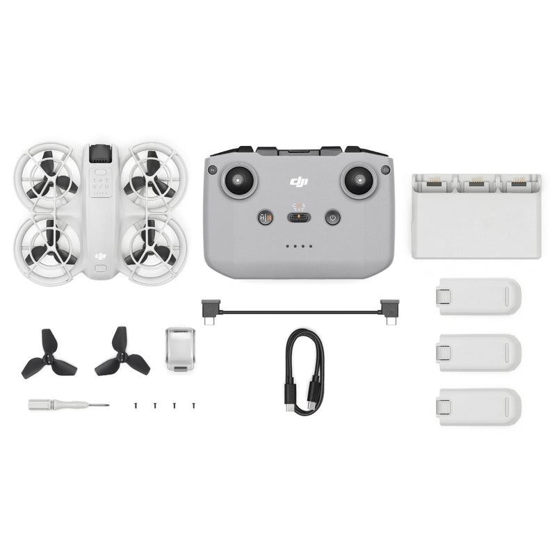 A birds eye view of the DJI Neo with the DJI RC-N3 and three batteries as well as a charging hub and cables.